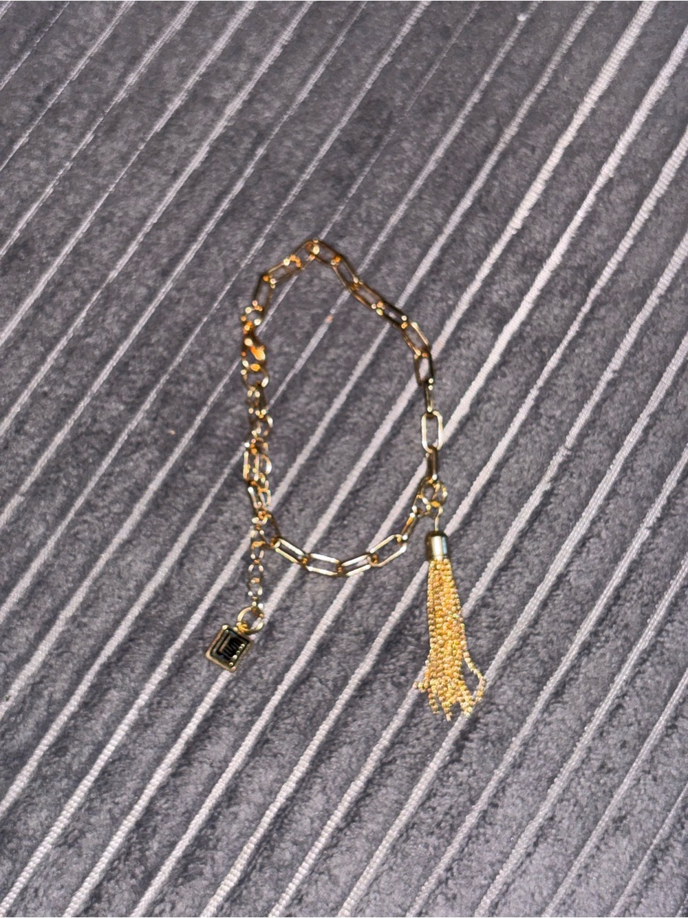 Elegant Gold Link Bracelet with Tassel Charm